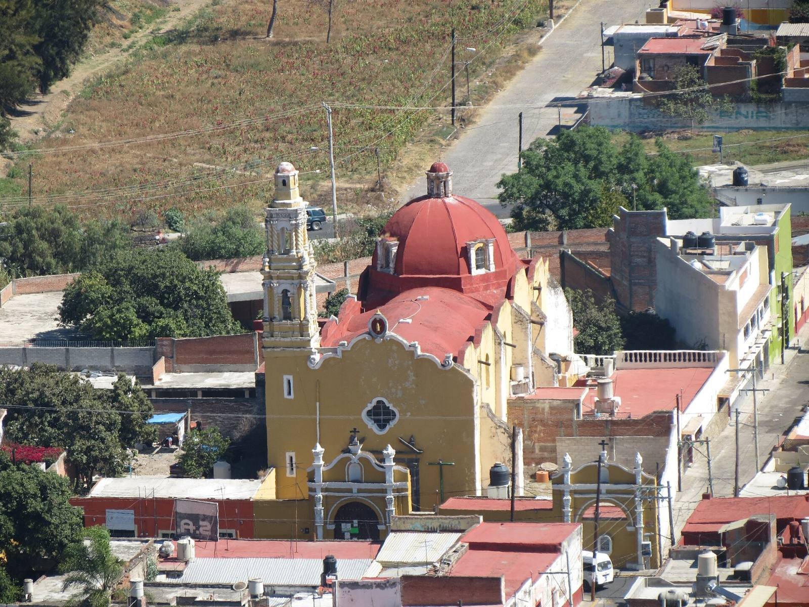 The red domes of the church of San Félix and the rooftops of Atlixco, seen from the Cerro de San Miguel