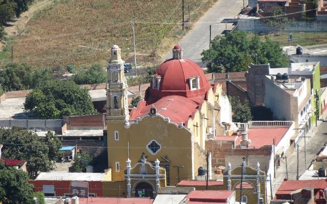 The red domes of the church of San Félix and the rooftops of Atlixco, seen from the Cerro de San Miguel