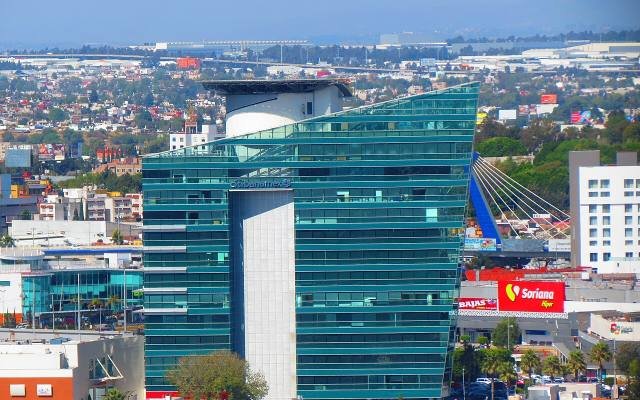 A modern glass office tower in the Angelópolis district of Puebla