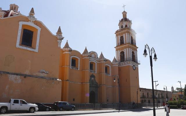 The orange church of San Pedro on the main square of Cholula